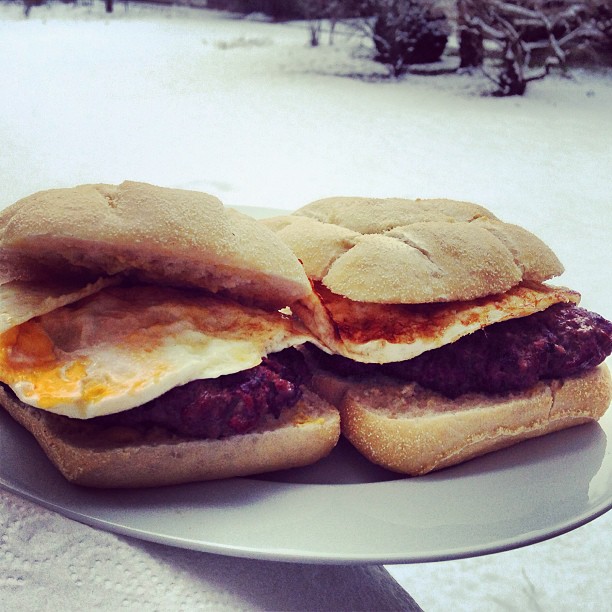 burgers with fried eggs in the snow