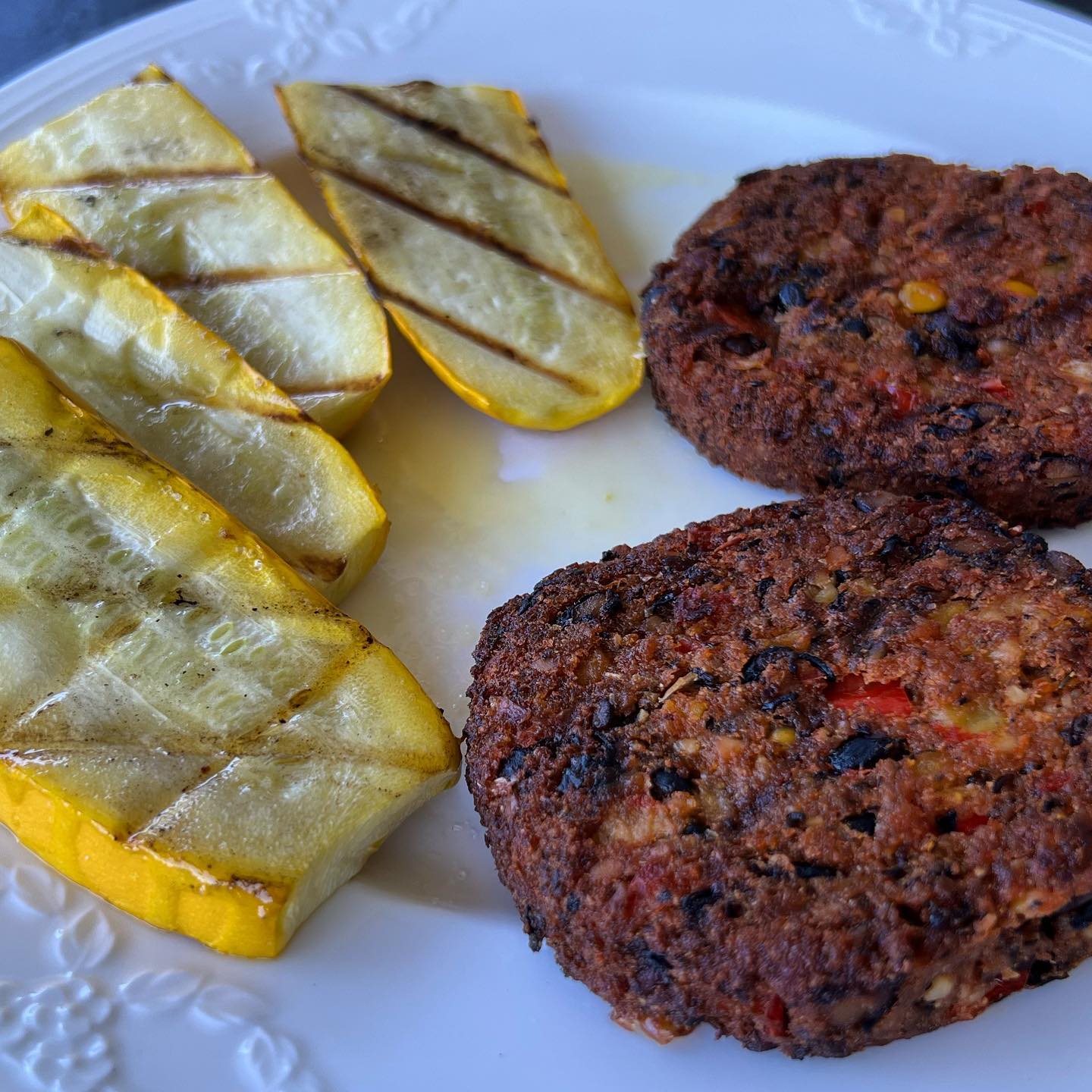 Black bean, cashew patties with yellow zucchini on the for a non-meat lunch